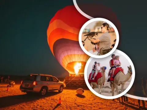 Hot air balloon over the Dubai desert with a 4x4 dune bashing trail below